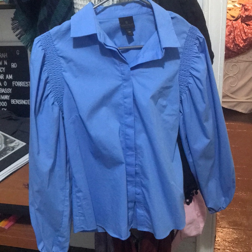 blue button down with sleeve detailing.